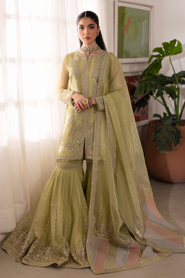 Naqshi eraj dusty‑lime organza short shirt with crystal‑embellished boat neckline, pastel‑tone sequin embroidery from neckline to mid‑slit, paired with high‑waist organza gharara.