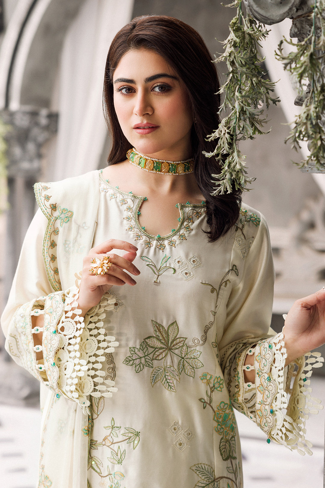 Close view of sleeve embroidery with organza borders and loops detail