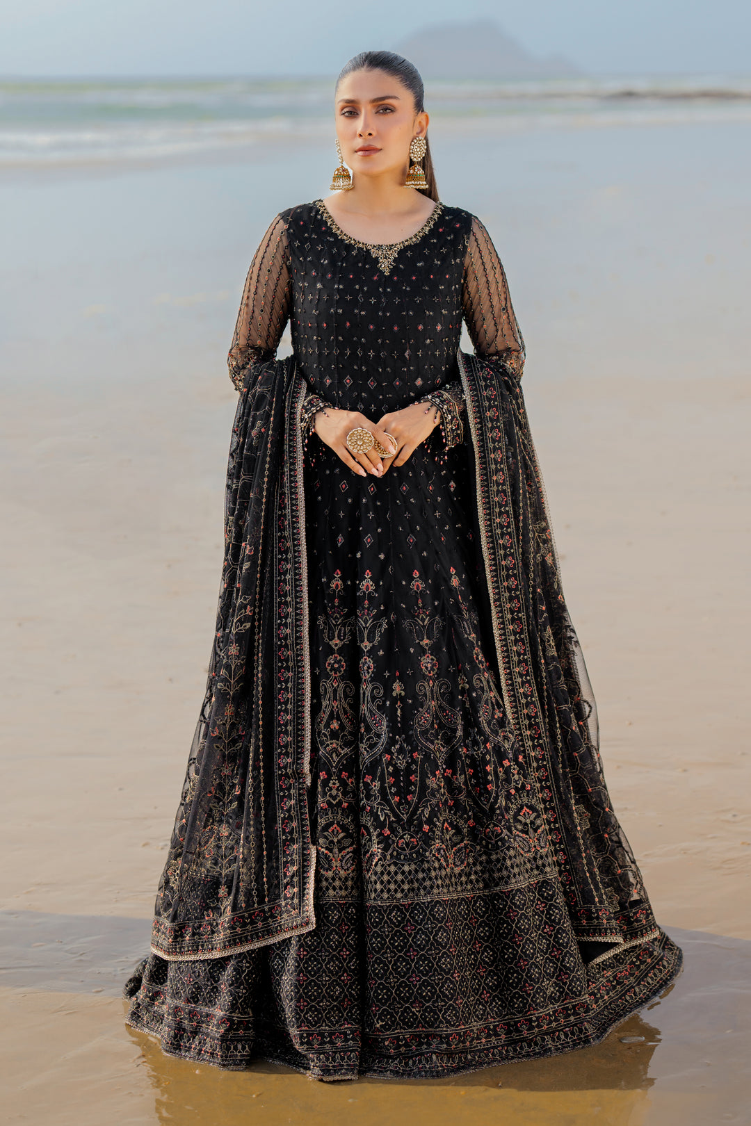 Model wearing full NAQSHI Blain set: black embellished net frock, plain straight PK raw‑silk pants, ornate dupatta with heavy embroidery &amp; tassels.