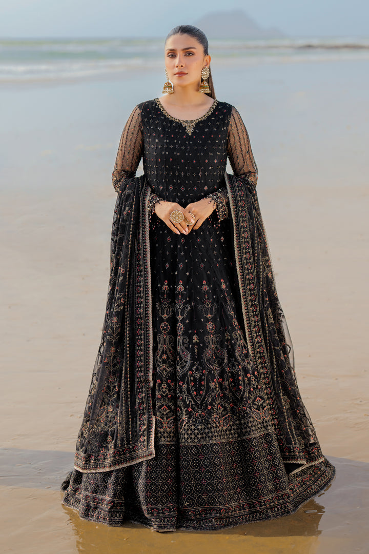Model wearing full NAQSHI Blain set: black embellished net frock, plain straight PK raw‑silk pants, ornate dupatta with heavy embroidery &amp; tassels.
