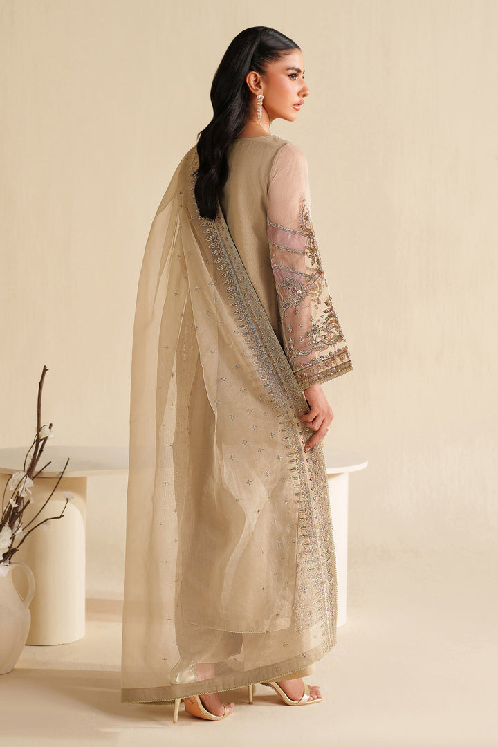 Side view of NAQSHI ivory beige formal ready-to-wear outfit showing straight cut, light embroidery, and polished event finish