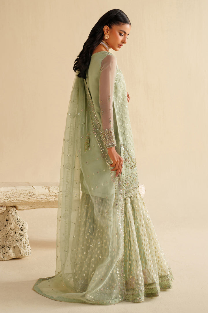 Back view of NAQSHI sage green dress highlighting dupatta fall and smooth, graceful look