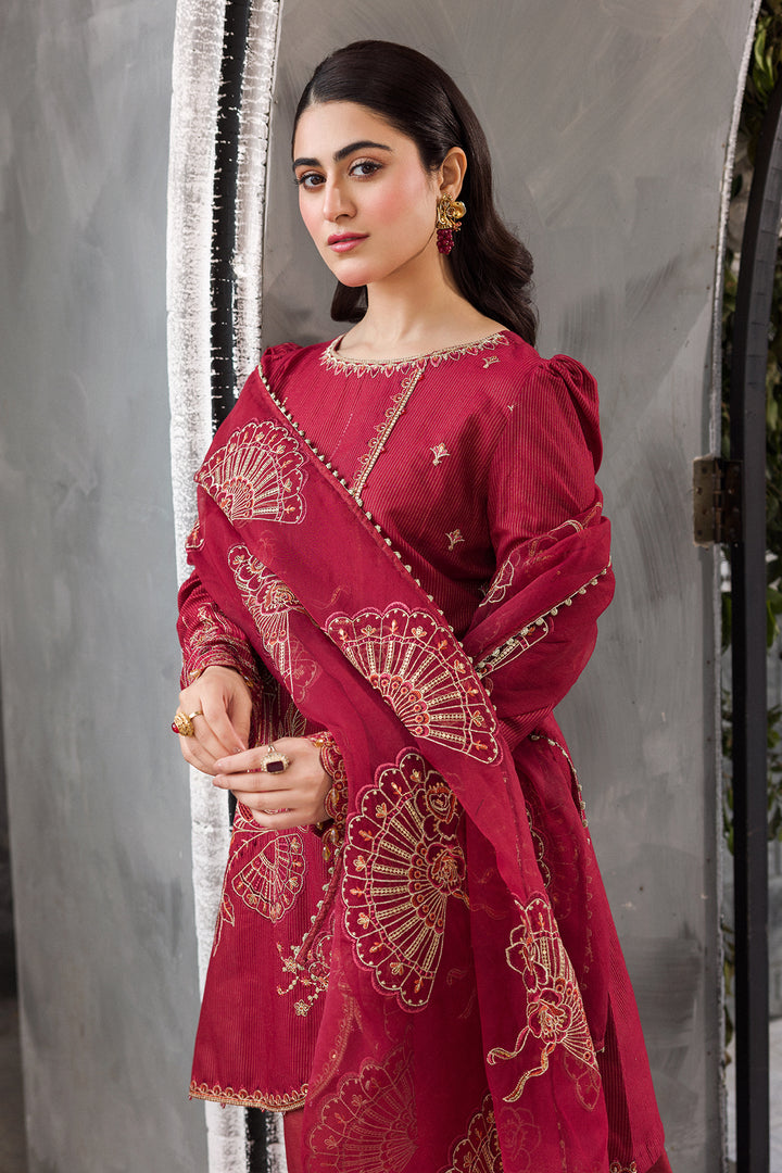 Side movement pose of Gajra short shirt sharara set showing lace finished dupatta