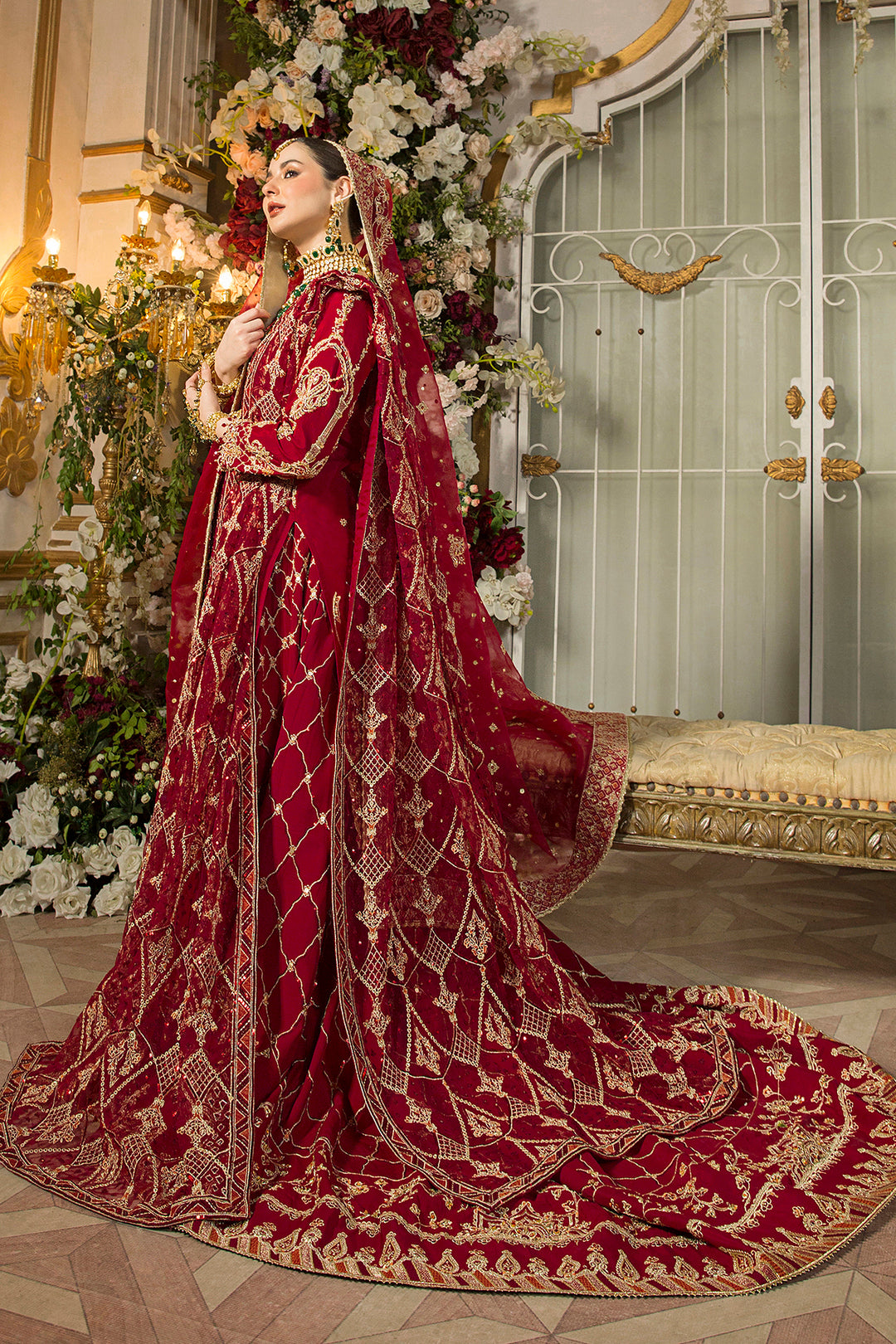 Side view of Gehna showcasing intricate embroidery on shirt and lehenga, hand-adda sleeves, sitting tassels, and dupatta drape.

