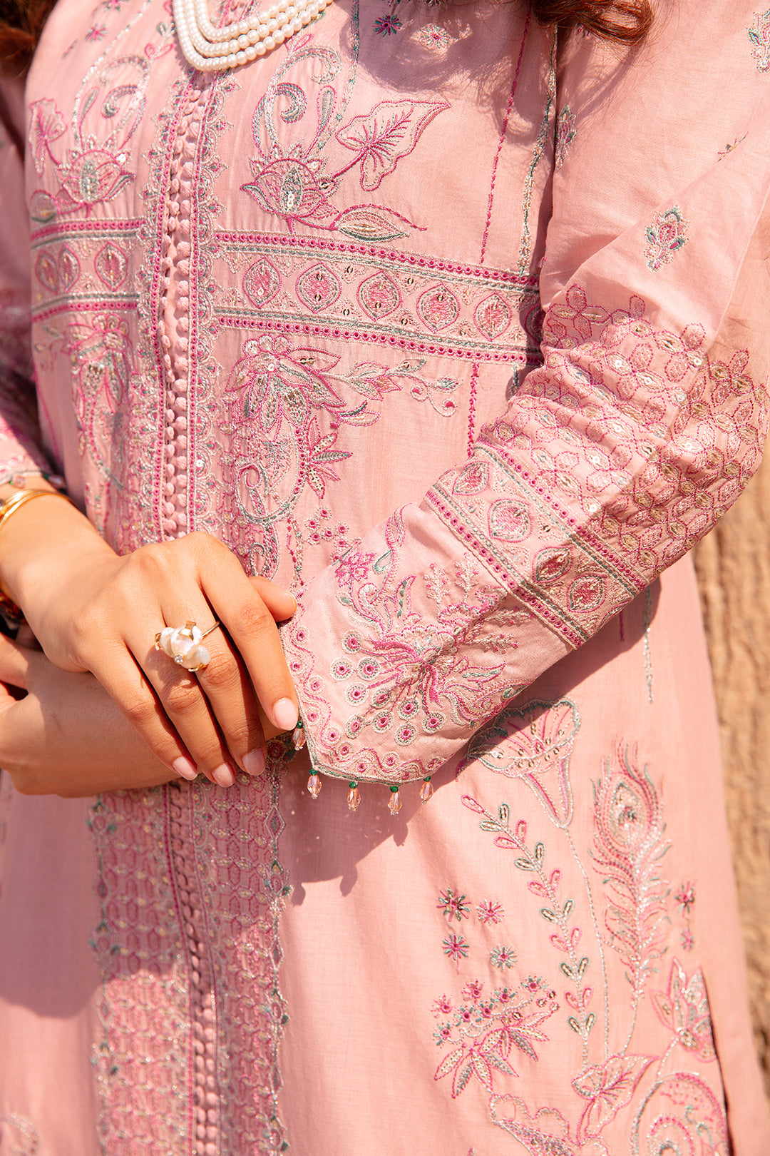 Detailed close up of sleeve embroidery lace cuffs and organza patch on Jazmin tea pink ready to wear 3PC outfit