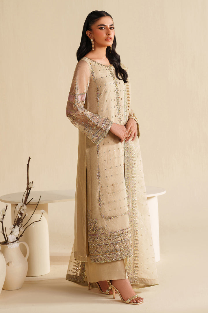 Side view of NAQSHI ivory beige formal ready-to-wear outfit showing straight cut, light embroidery, and polished event finish