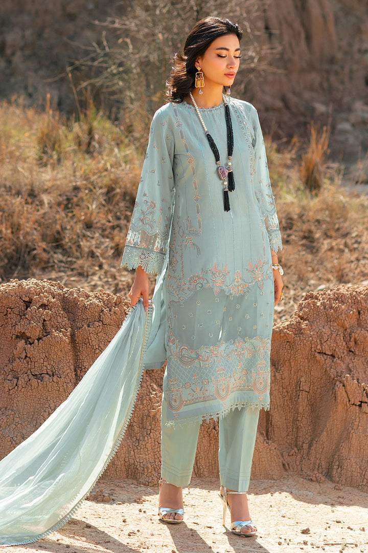 Front standing view showing aqua long shirt with detailed embroidery and organza dupatta lace border festive wear dress