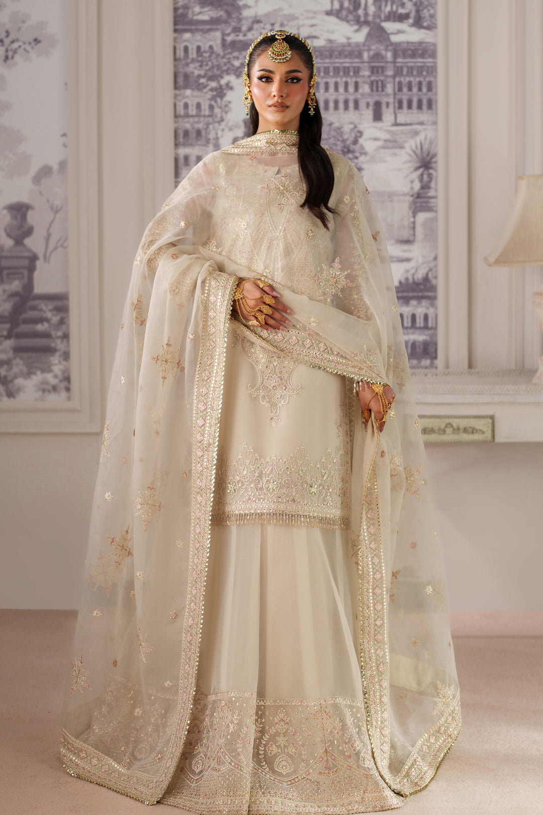 Full front standing pose of NAQSHI Seemal cream ready-to-wear event dress with embellished dupatta for formal celebration looks.