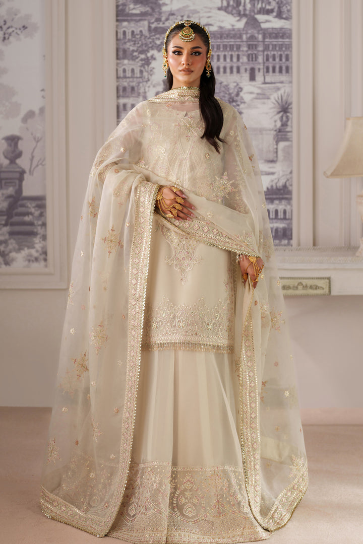 Full front standing pose of NAQSHI Seemal cream ready-to-wear event dress with embellished dupatta for formal celebration looks.