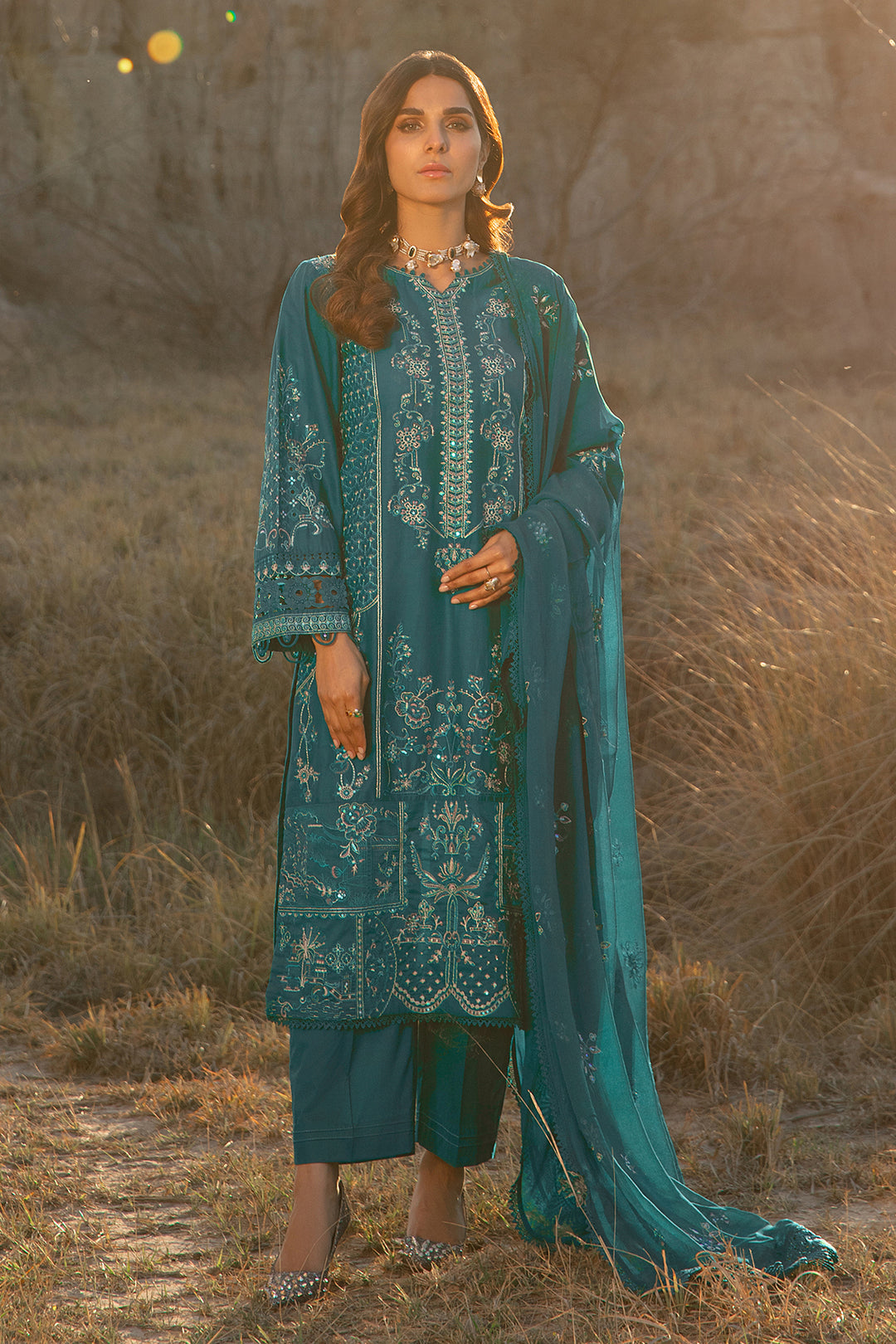 Walking pose of zinc ready to wear 3 piece suit with long shirt and straight trousers suitable for family functions