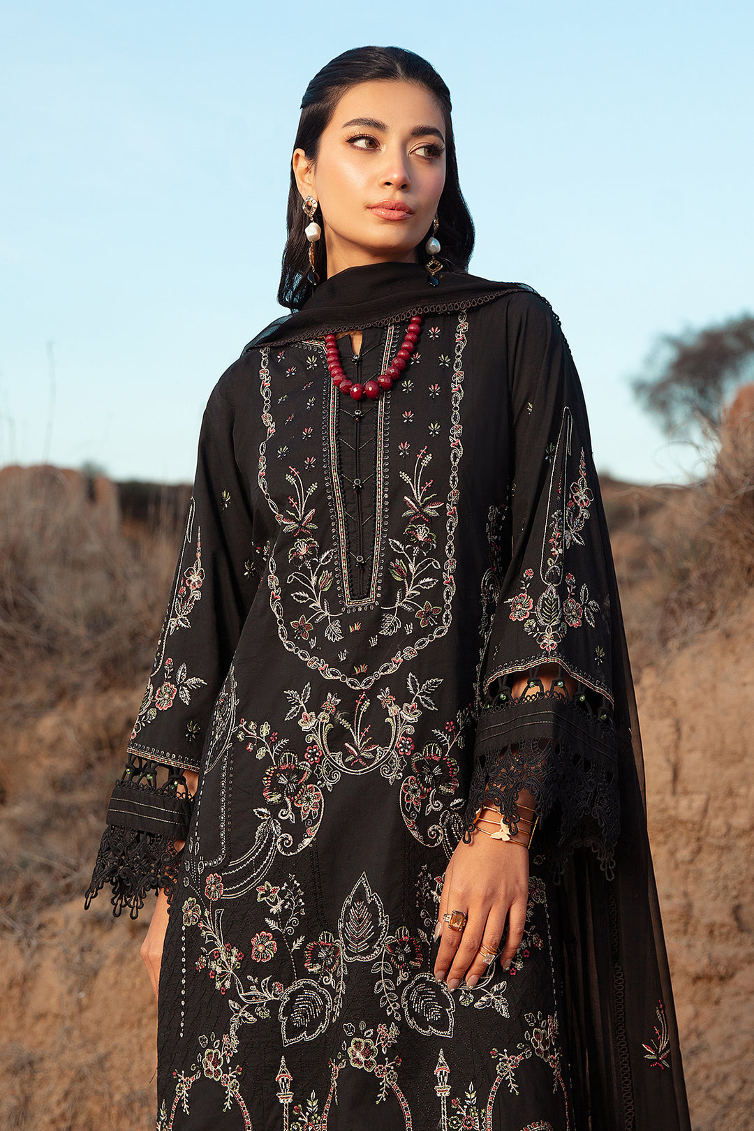 Full length view of Surmaya black 3 piece suit showing balanced long shirt cut with straight trousers