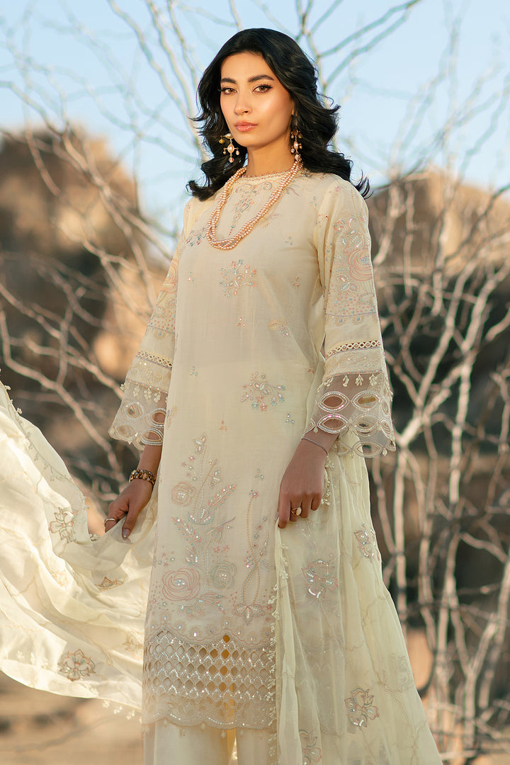 Side angle view of light yellow embroidered lawn suit with flowing crinkle dupatta festive ready to wear dress