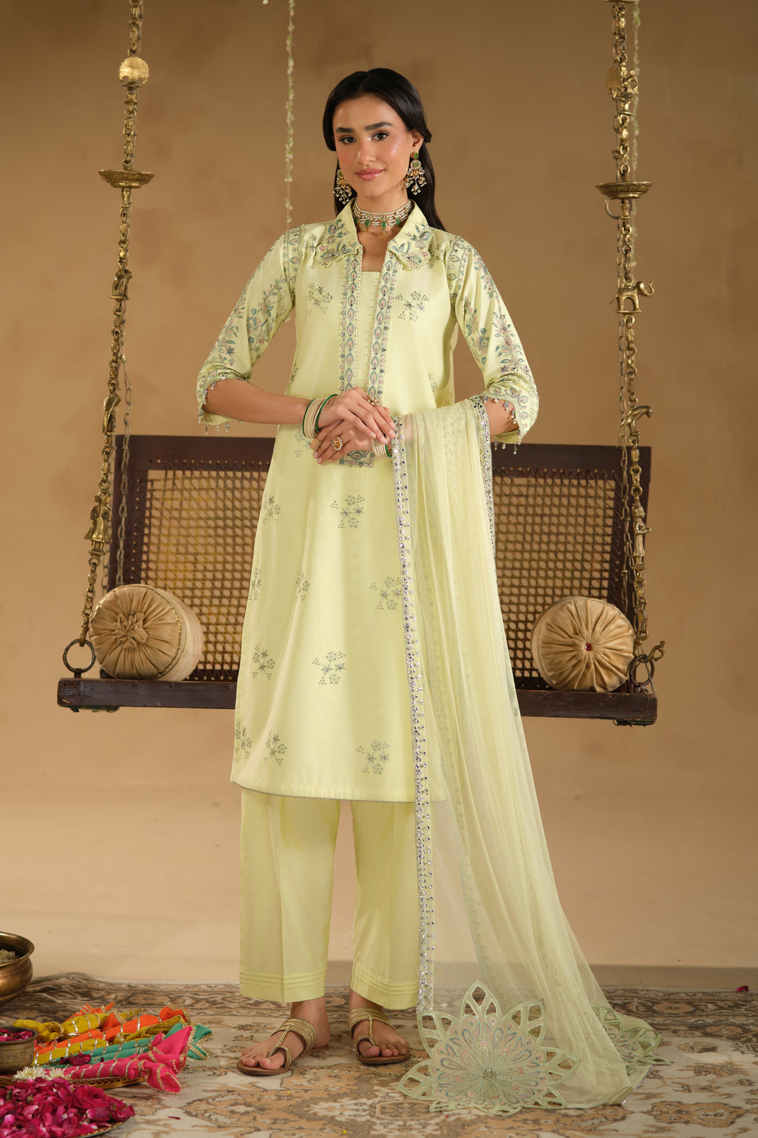 Front full length look of Nagma light lime festive outfit with vertical neckline embroidery and lightweight dupatta drape