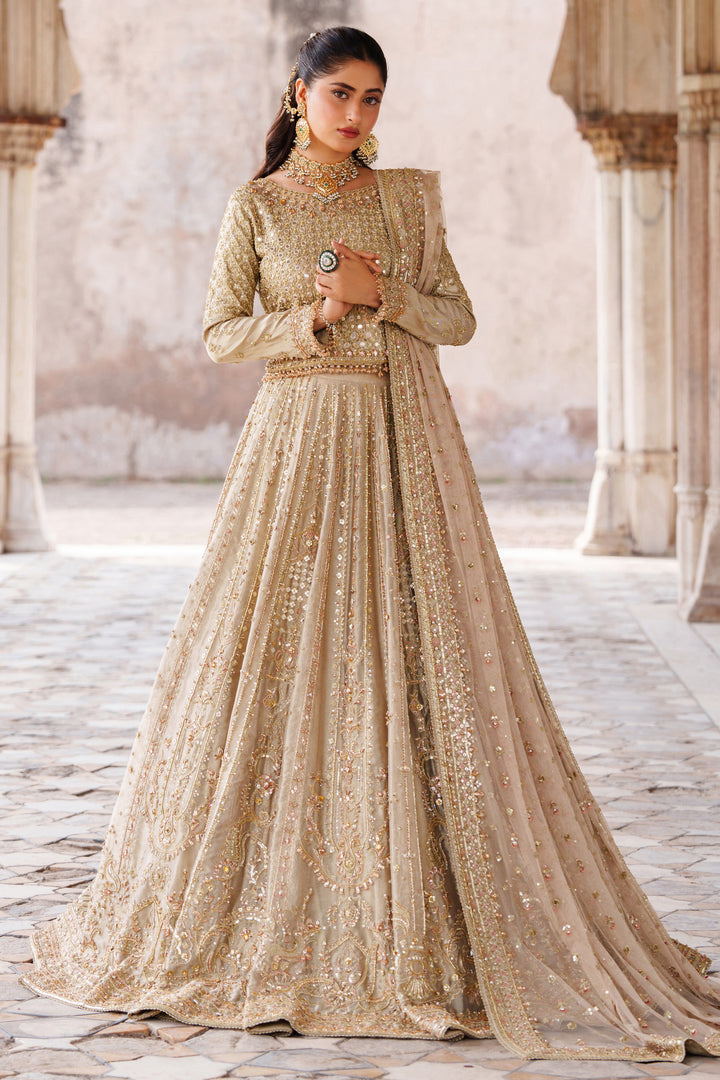 NAQSHI Ruhab champagne gold embroidered ready-to-wear bridal gown with full flare skirt and detailed embellishments for wedding and reception events.