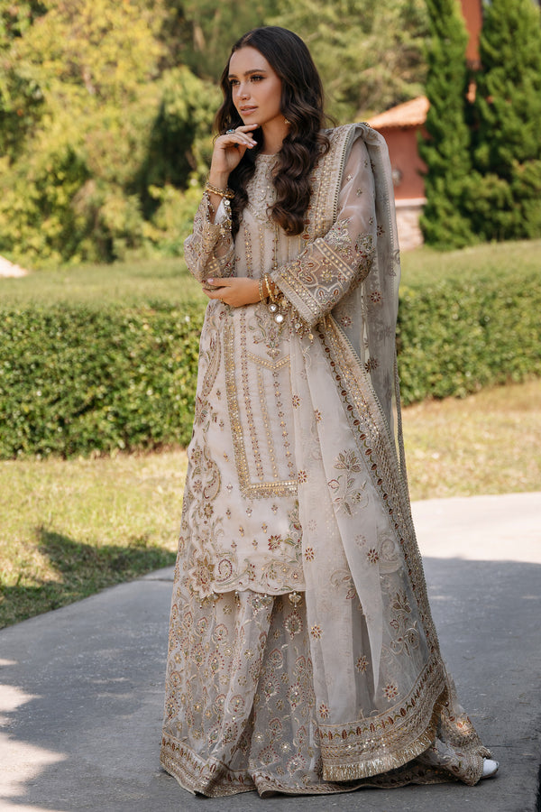 Beige organza embroidered shirt and sharara by NAQSHI with tilla work, sequins, tassel neckline, crystal sleeve details, and matching dupatta for weddings.