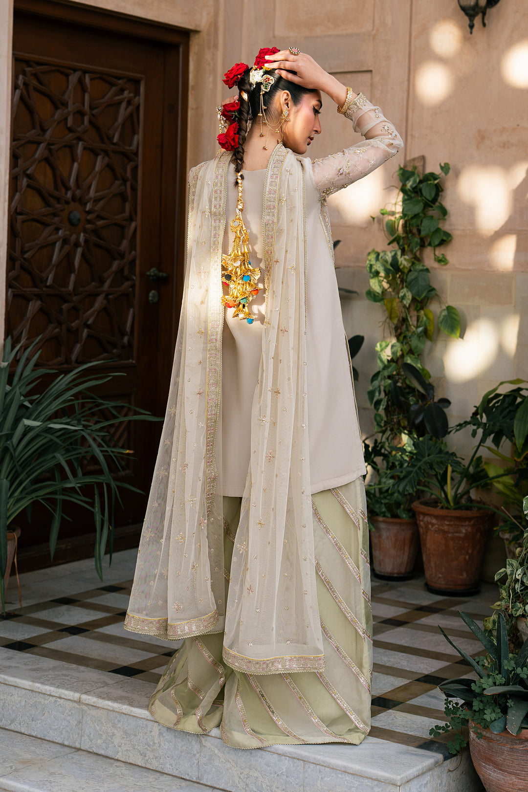 Saaz skin organza semi formal outfit with embroidered shirt, pistachio flared trousers and embroidered net dupatta