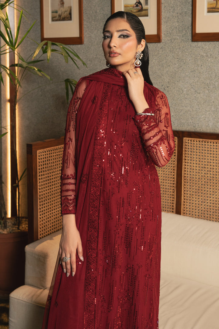 Full front view of NAQSHI Valentina rose red net outfit showing high-neck shirt, all-over embroidery, sequins, adda work, and straight trousers.