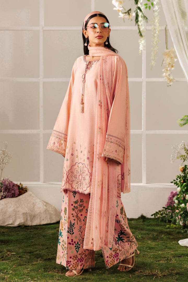 Full front standing view of NAQSHI Hoorish outfit showing peach cotton satin shirt and printed culotte trousers