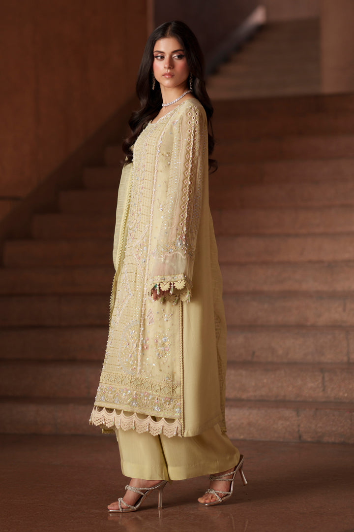 Side view of Luzia light lime embroidered khadi net dress featuring flowing silhouette, wide sleeves and elegant cotton organza dupatta