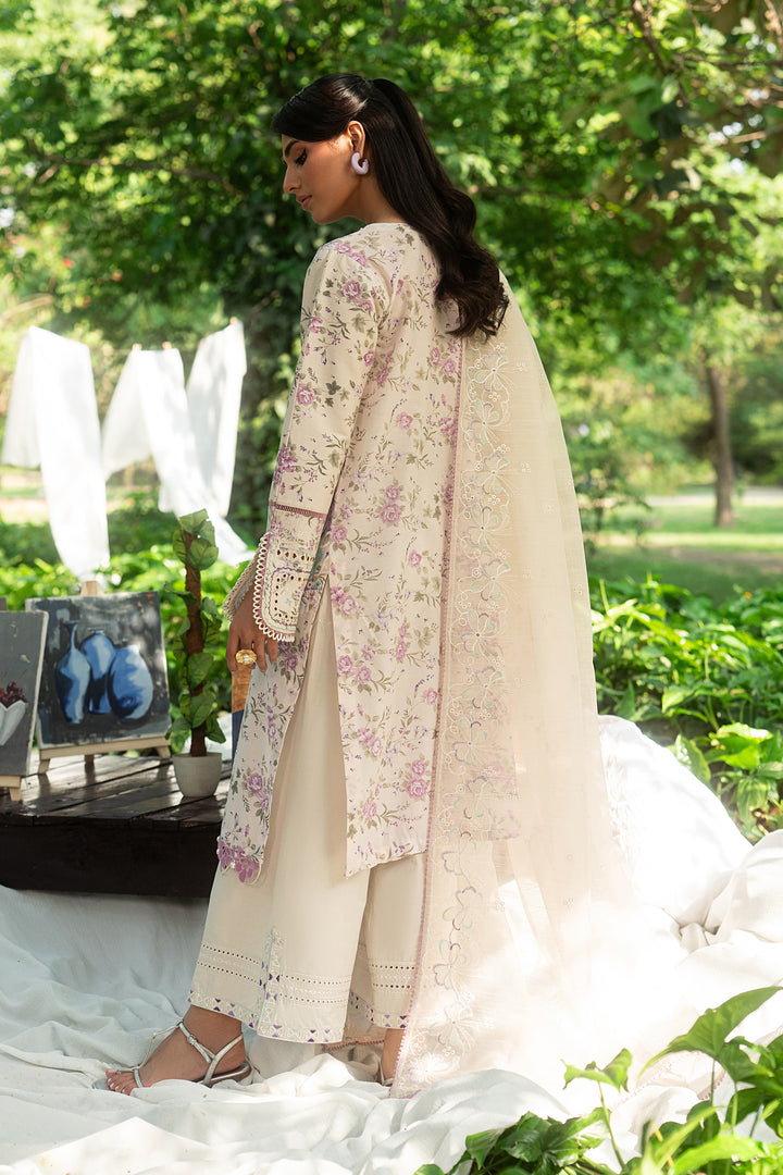 Back view of Baseera ivory lawn shirt with relaxed straight cut and light embroidered sleeves paired with culotte cambric trouser