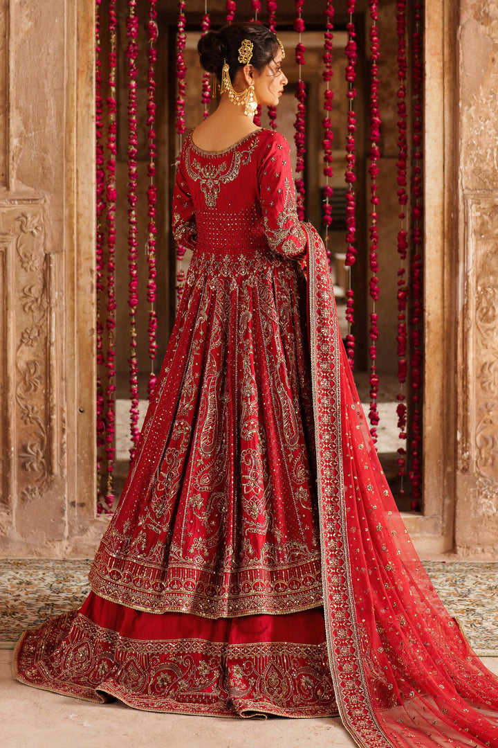 Back view details of NAQSHI Zeban red bridal lehenga with fine embroidered patterns and decorative stitching for formal wedding look.