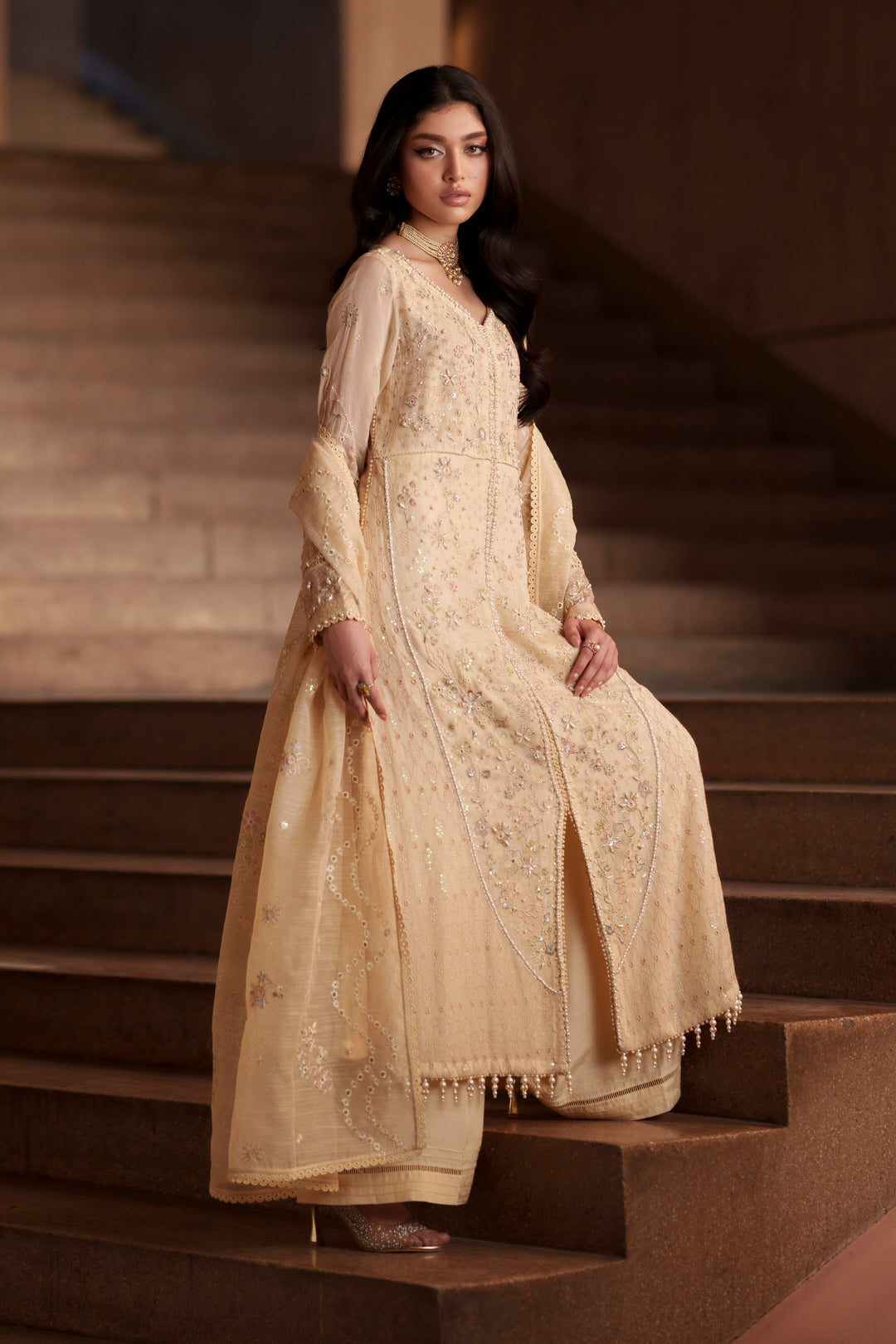 Side view of Igor vintage cream embroidered khadi net dress featuring flowing silhouette, elegant flare and embroidered cotton organza dupatta