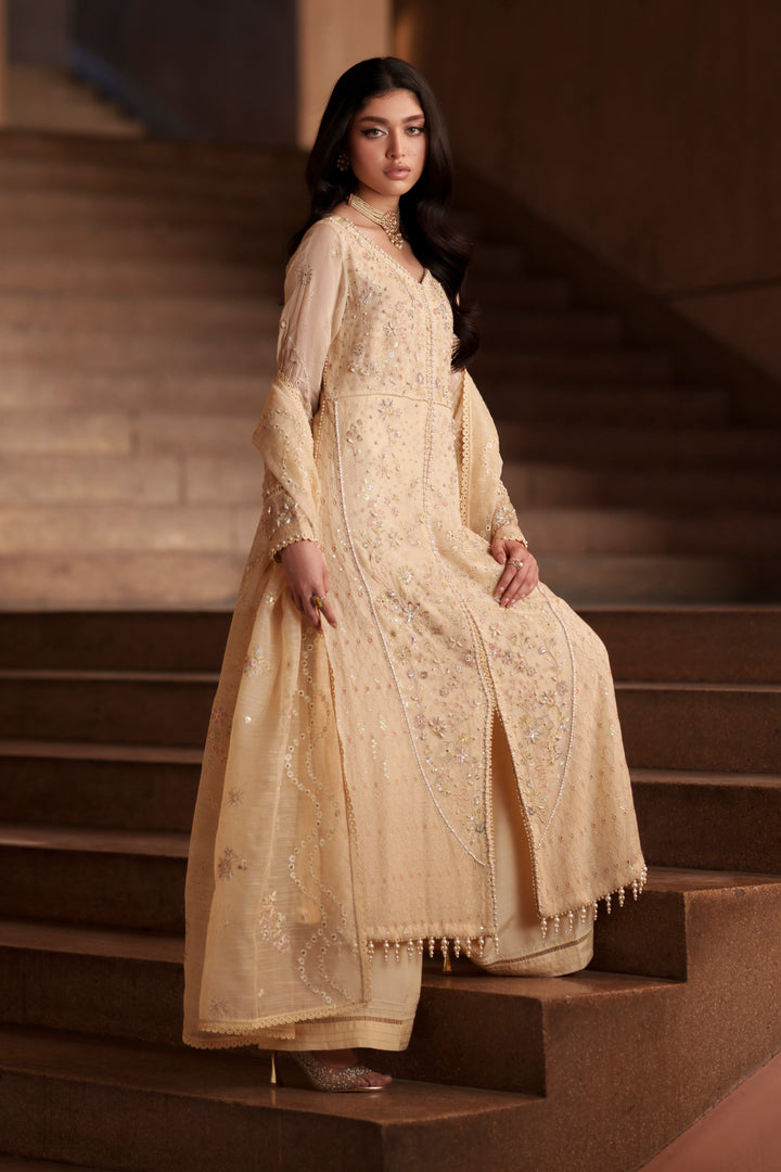 Side view of Igor vintage cream embroidered khadi net dress featuring flowing silhouette, elegant flare and embroidered cotton organza dupatta