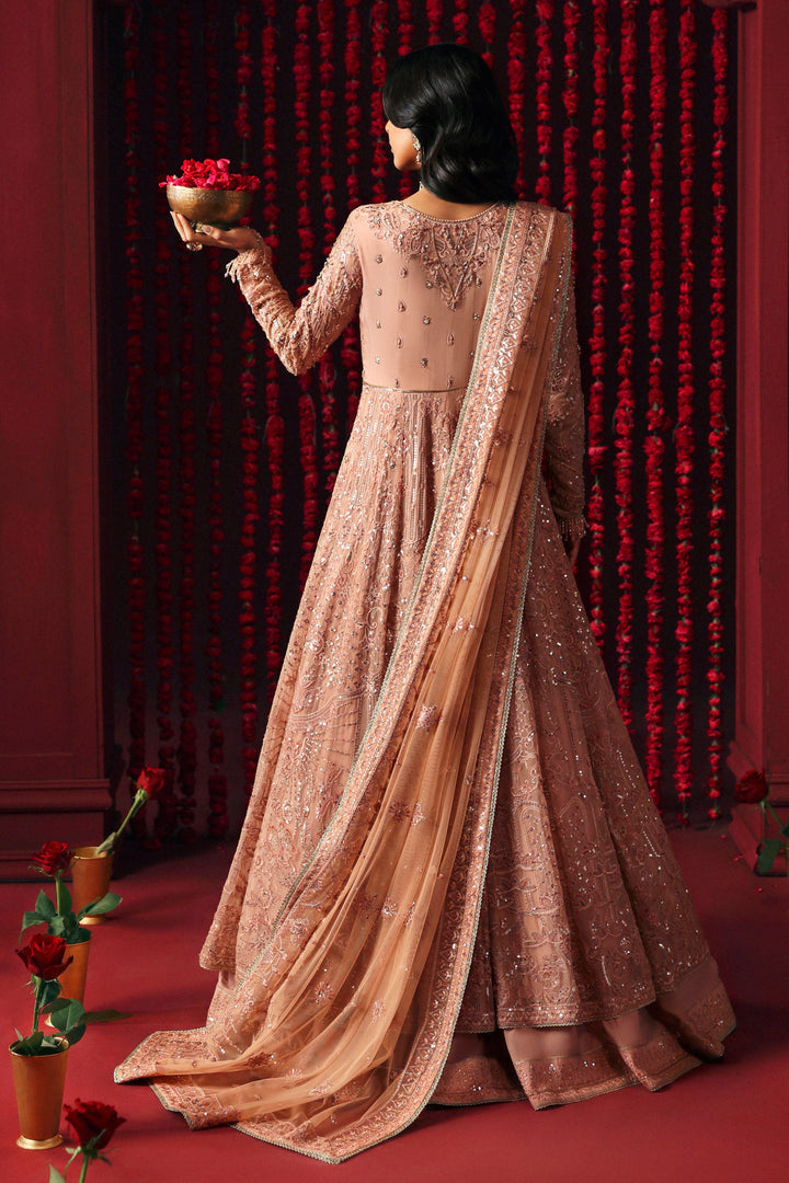 back view of NAQSHI Ashiayana in peach showcasing angled sleeve detail and sequined panel flare