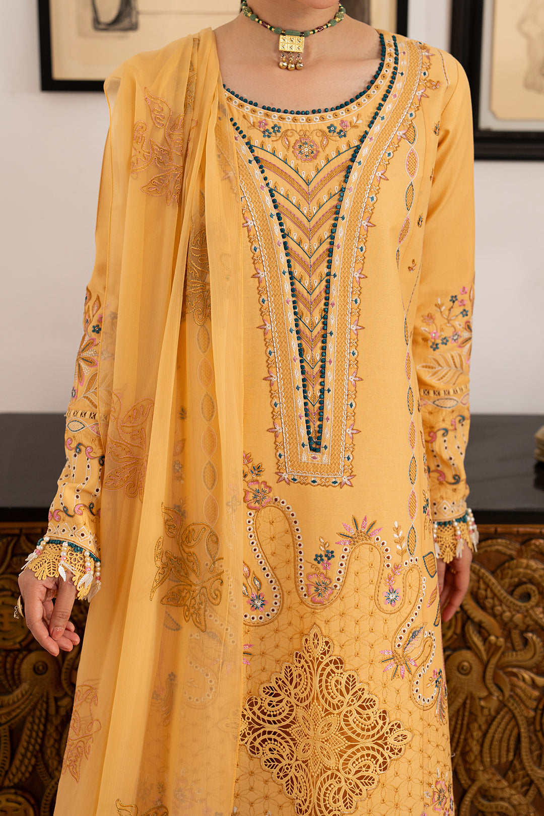 Close-up of Anasia embroidered lawn shirt highlighting intricate neckline embroidery, decorative panels and colorful border detailing