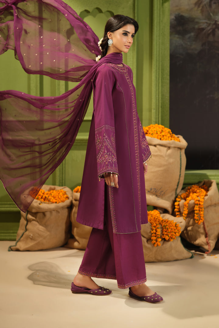 Side view of NAQSHI Huram plum embroidered Pima lawn shirt paired with cambric culotte trousers and crinkle dupatta