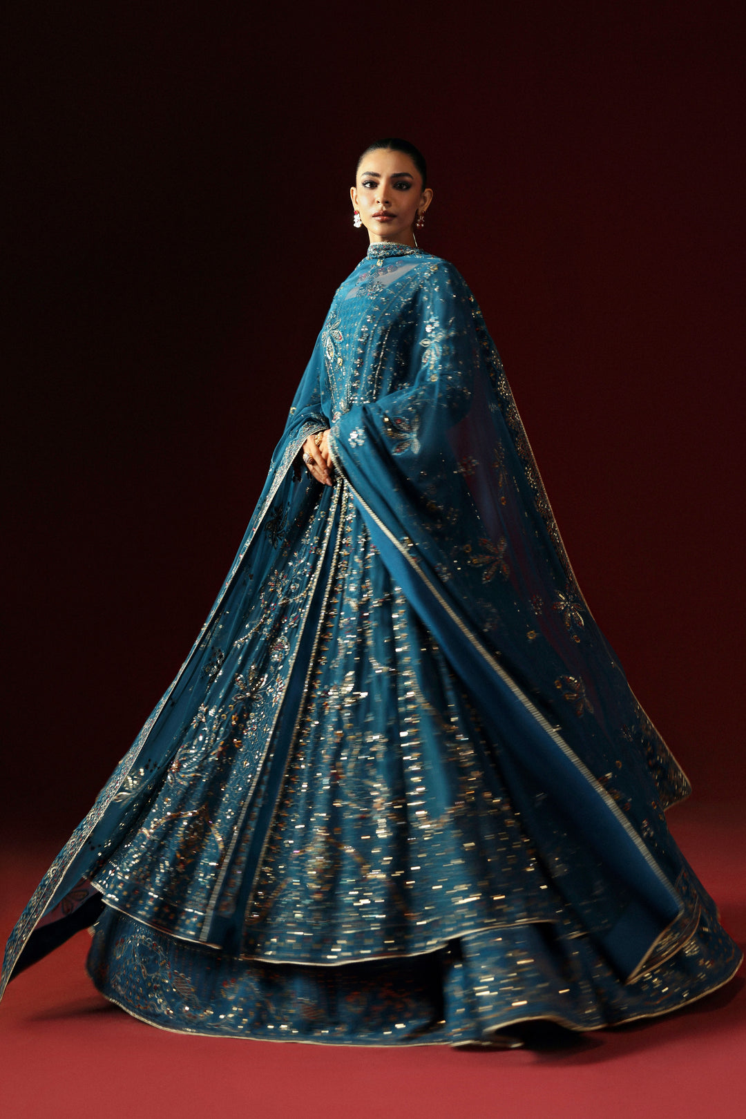 Side profile of NAQSHI Marina in zinc showing full panel flare, adda embroidery and sequined sleeve edge