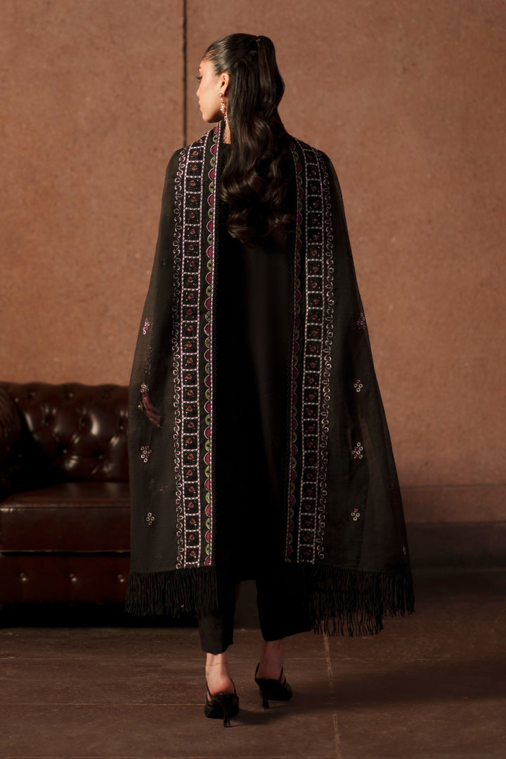 Back view of NAQSHI Zeya black luxury pret outfit showcasing long embroidered khadi net shirt, layered styling and graceful dupatta drape