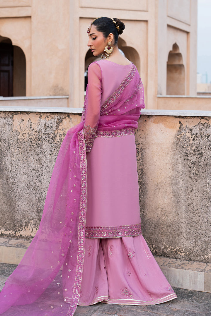 Side view of Shams lilac organza festive outfit with embroidered long shirt and flared trousers