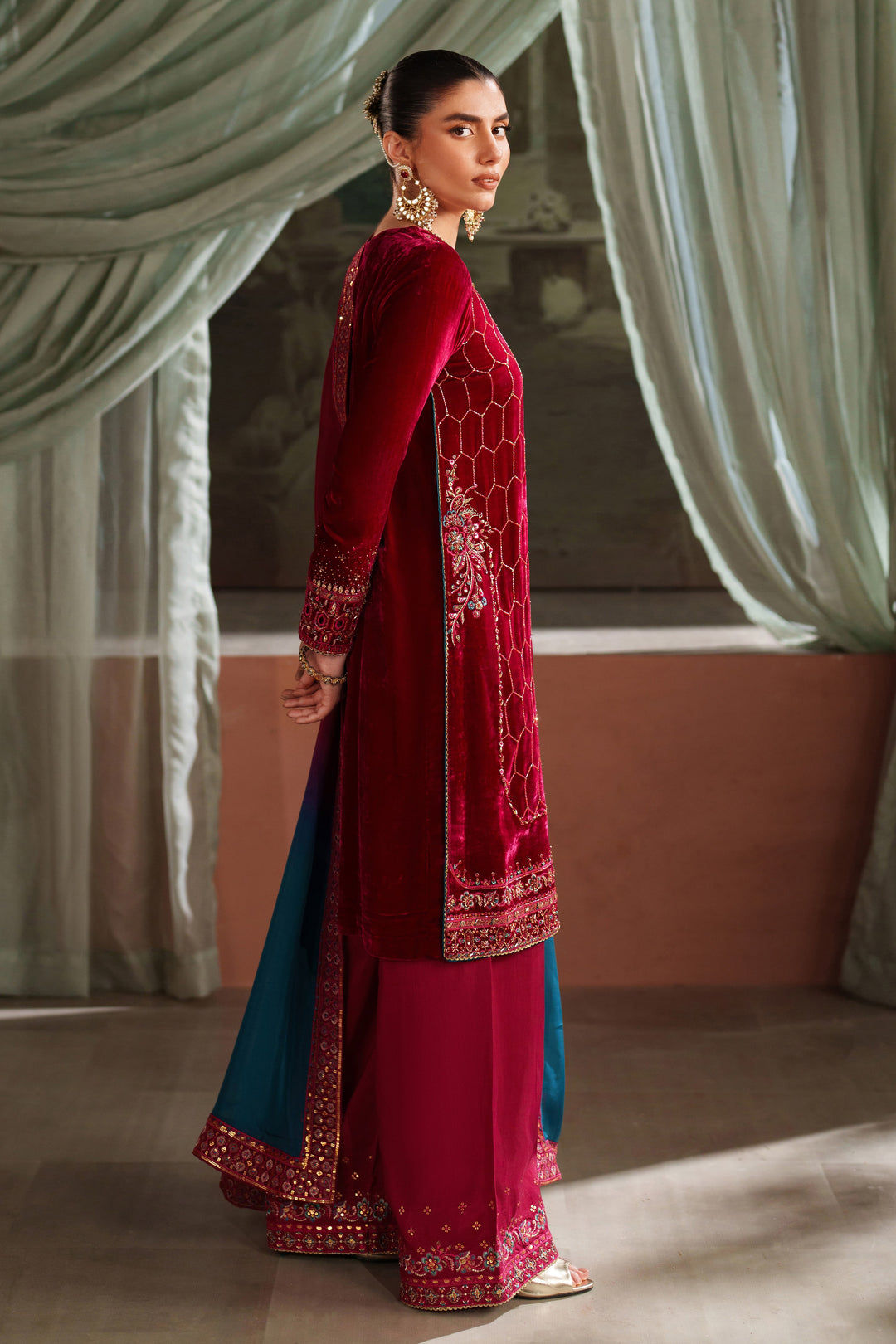 Side back view of NAQSHI deep red formal ready-to-wear dress with contrast dupatta styled for event wear