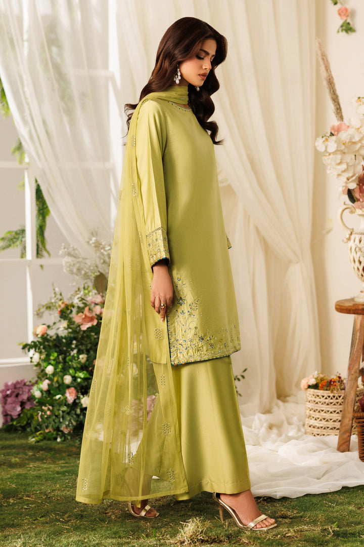 Side angle of NAQSHI Qiana outfit highlighting relaxed cotton satin shirt and easy casual silhouette