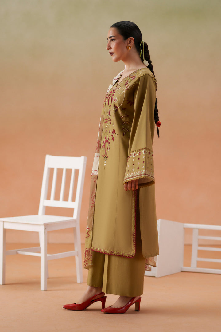 Side view of Lona olive beige ready-to-wear dress showing long embroidered lawn shirt, culotte trouser, and flowing printed dupatta.