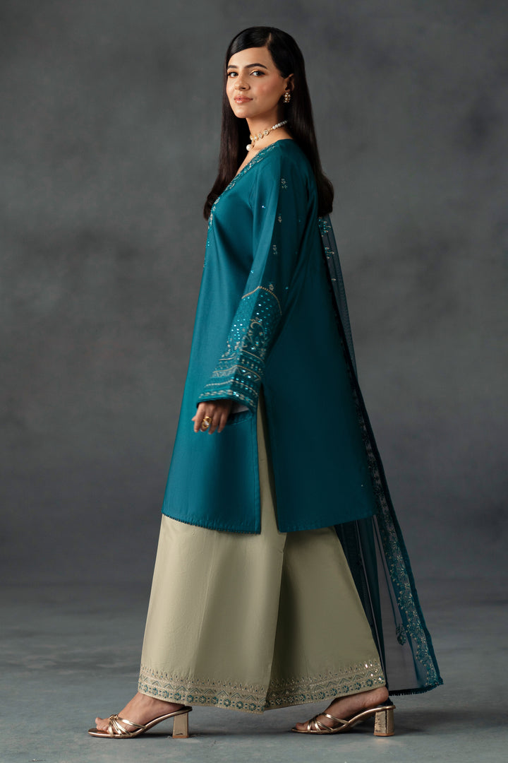 Areeb by NAQSHI angled view showing embroidered border detail and sequin embellishments