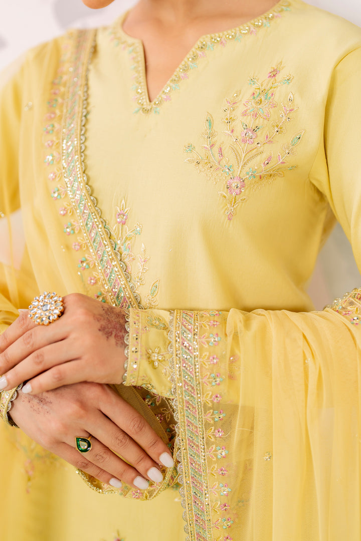 Close up of band neckline embroidery sequins and motif work on yellow pima lawn shirt