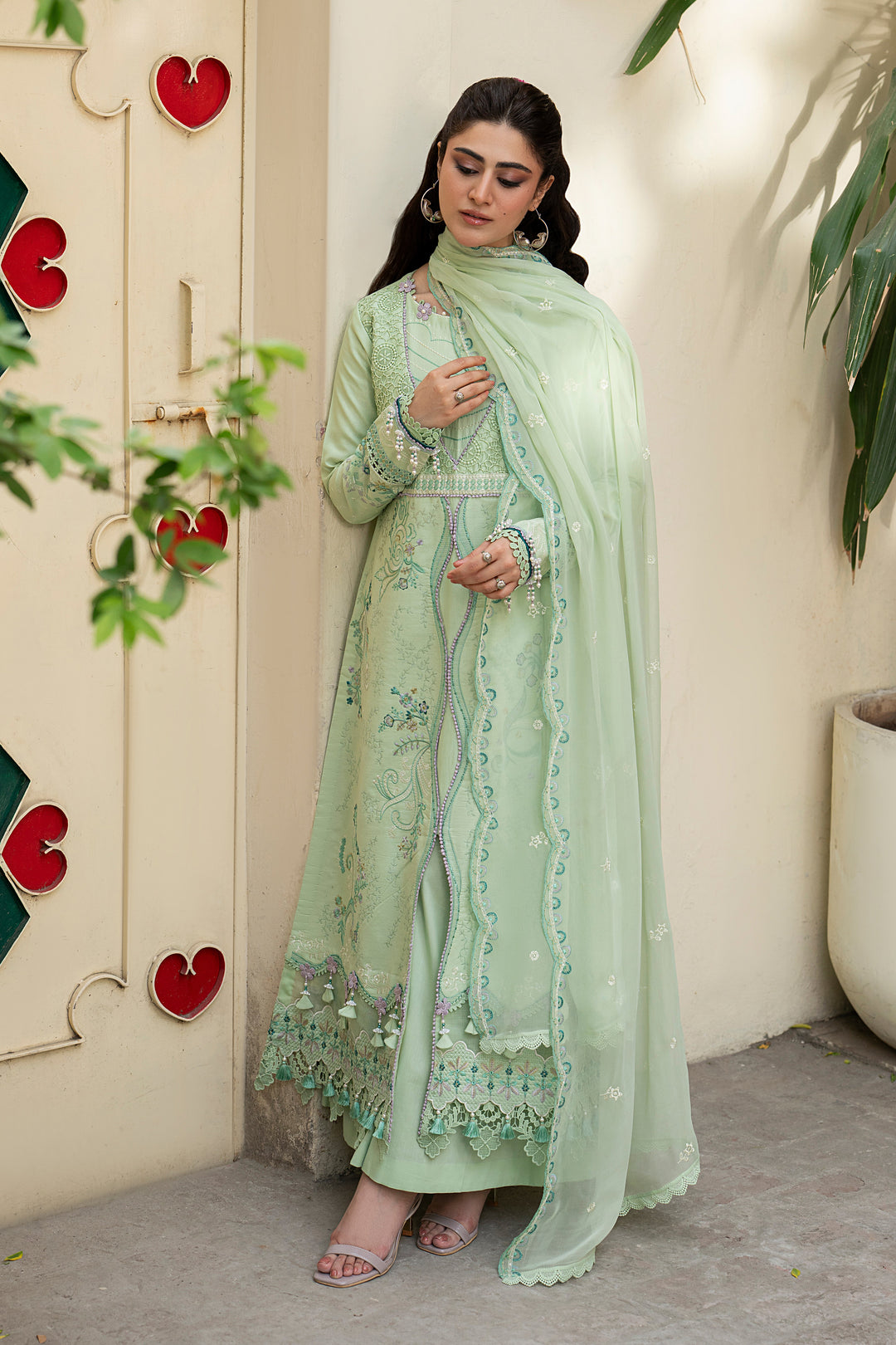 Tasveeb mint green embroidered lawn dress styled for summer gatherings with detailed floral embroidery, lace accents and elegant Eastern silhouette