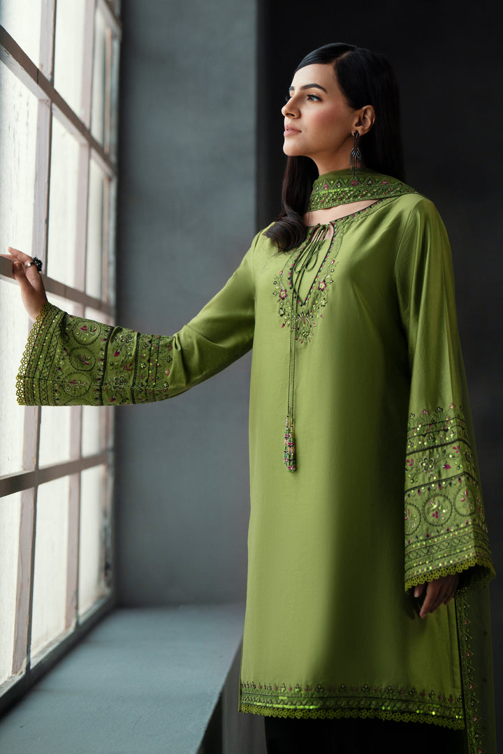 Styled presentation of NAQSHI Abeera lime green formal outfit with embroidered neckline and net dupatta for wedding celebrations and festive events