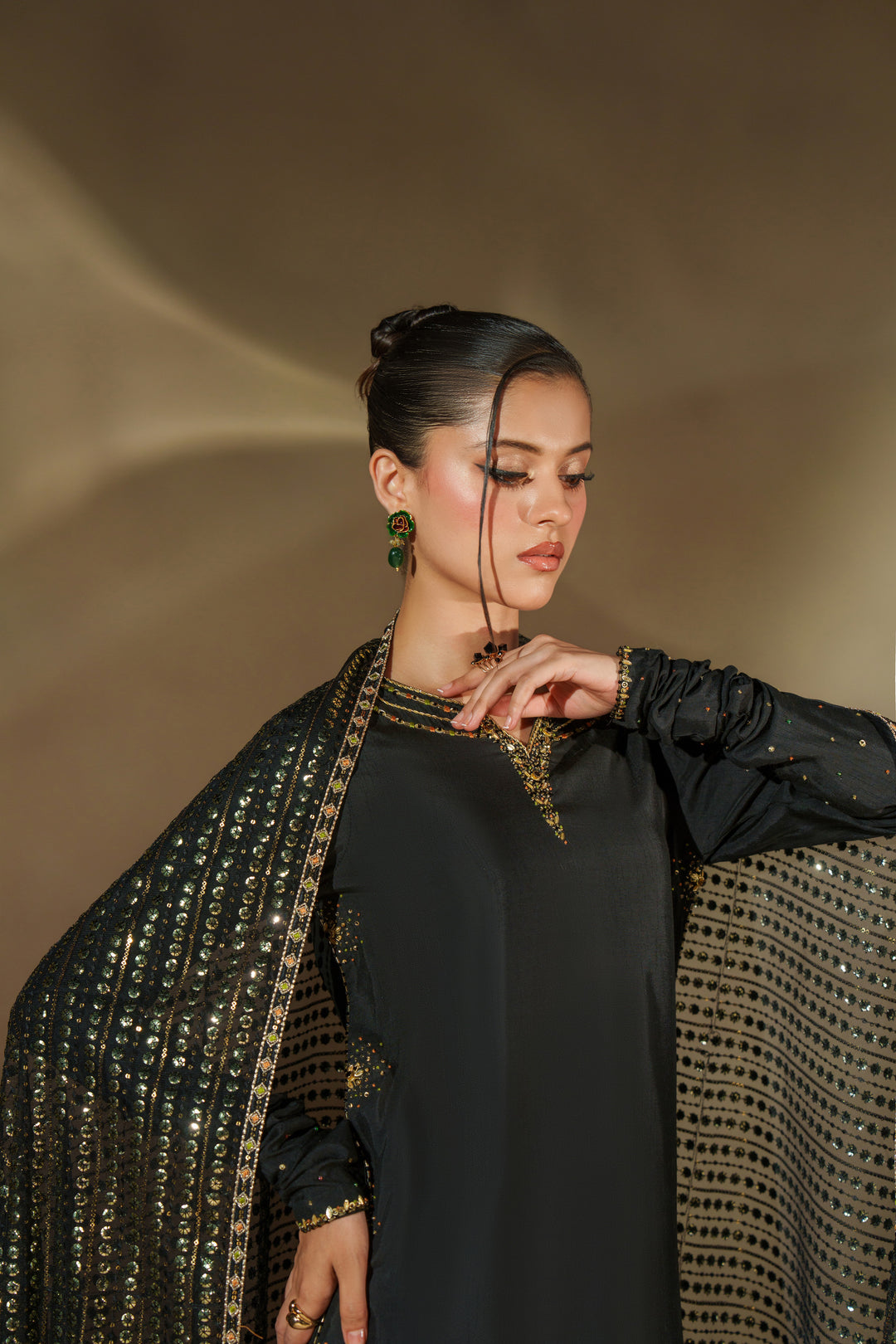 Close-up of NAQSHI Misam black formal dress neckline and sleeve adda work showing fine craftsmanship and premium texture