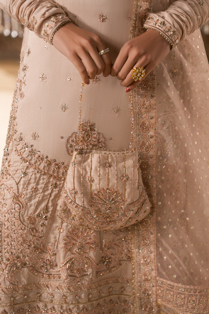 Close up detail of Mahbeer embroidery and matching pouch in pale pink tone, neat stitching formal Nikkah wear for women.