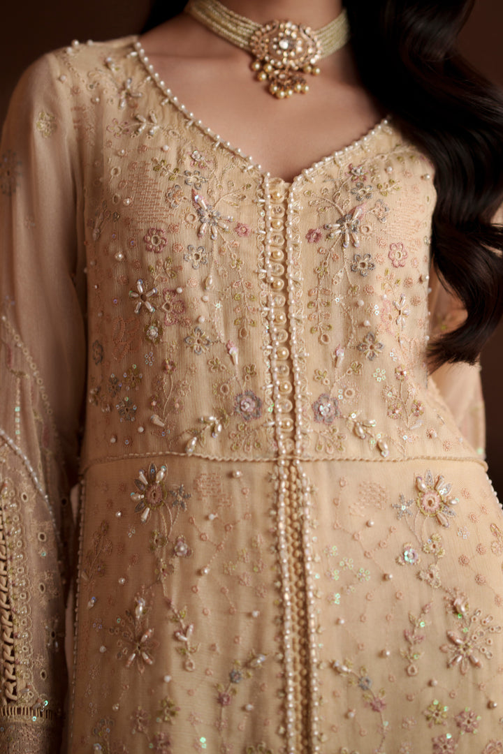 Close-up of Igor vintage cream embroidered khadi net shirt highlighting intricate embroidery, loop button detailing and refined neckline design
