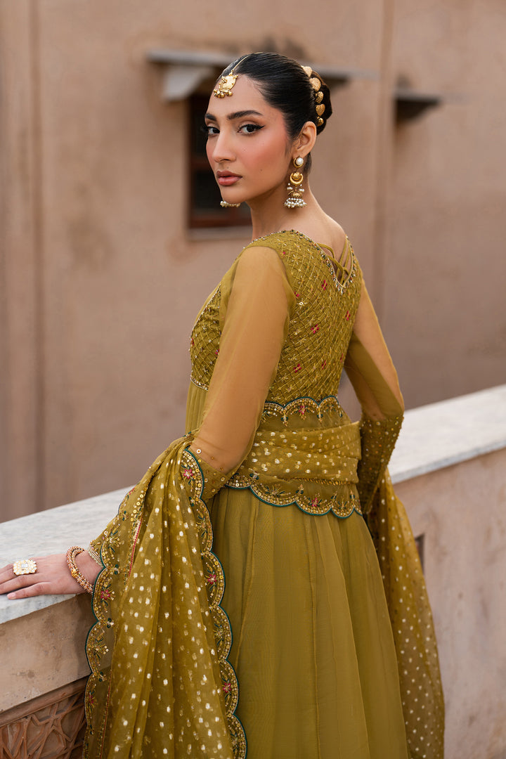 Side view of Lehr mustard organza embroidered frock with pleated sleeves and flowing festive silhouette
