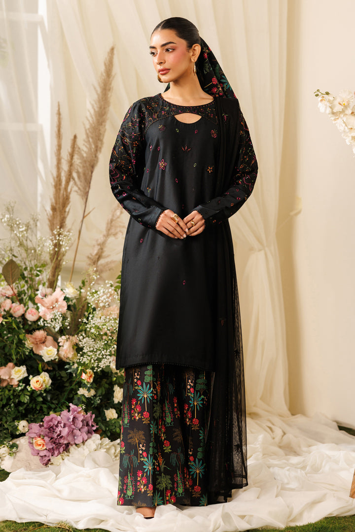 Full front view of NAQSHI Halia outfit showing near-to-neck embroidered neckline and clean black silhouette