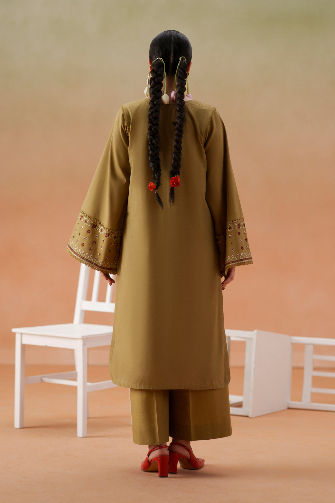 Back view of Lona olive beige 3-piece outfit with long lawn shirt, relaxed culotte trouser, and printed crinkle chiffon dupatta.