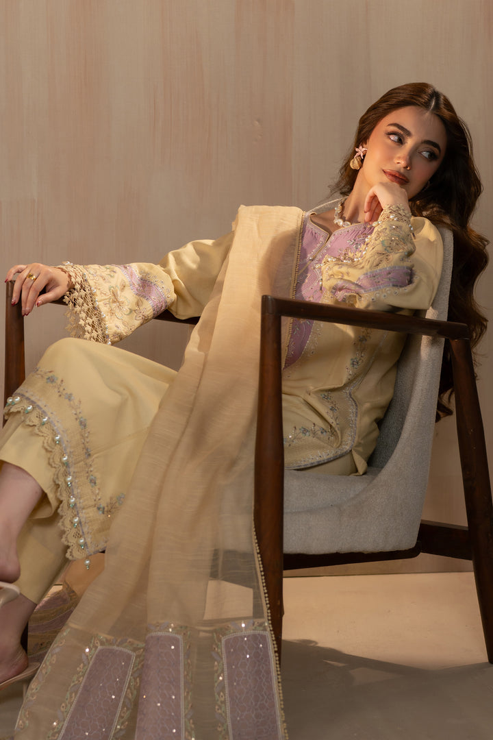 Seated styling pose of Nijah suit highlighting embroidered dupatta pallu and relaxed silhouette, elegant 3 piece ready to wear outfit.
