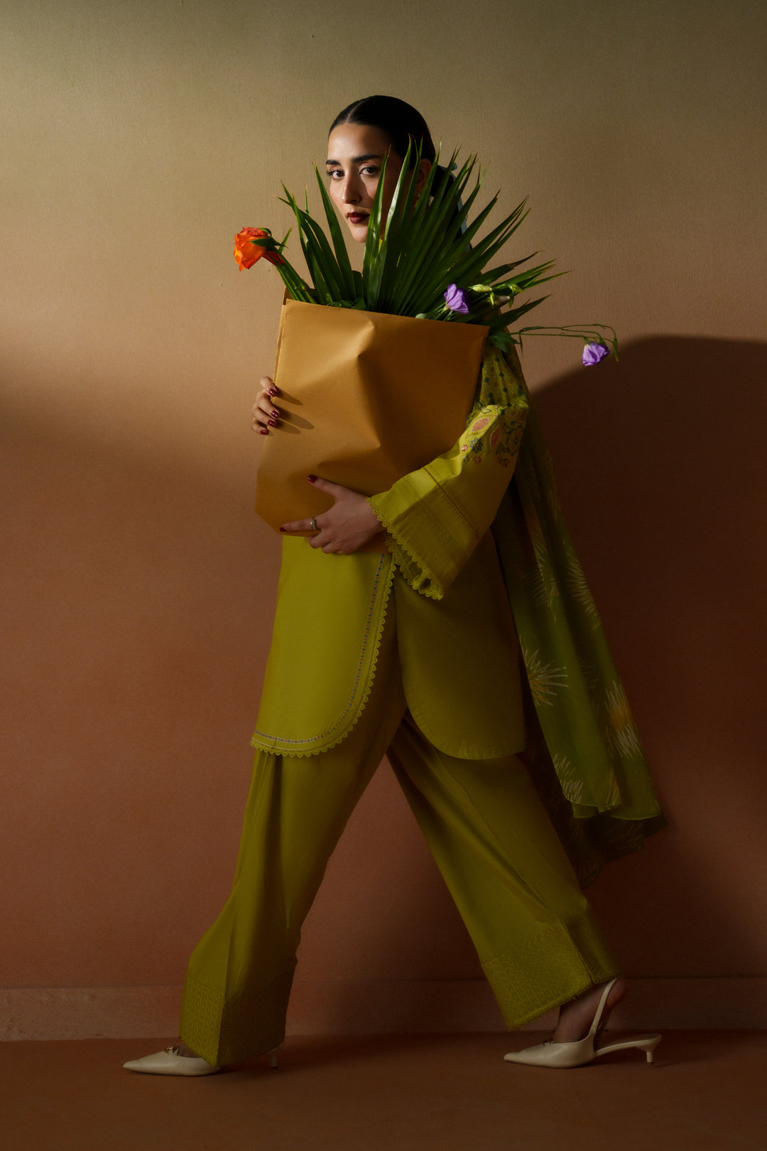 Model wearing Deniz lime embroidered ready-to-wear outfit with printed chiffon dupatta and floral styling for elegant daytime wear.