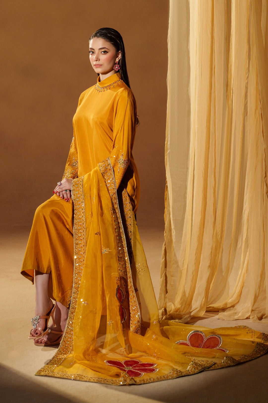 Full styled shot of NAQSHI Marlyin mustard yellow luxury pret outfit with embroidered dupatta set for festive events and evening celebrations