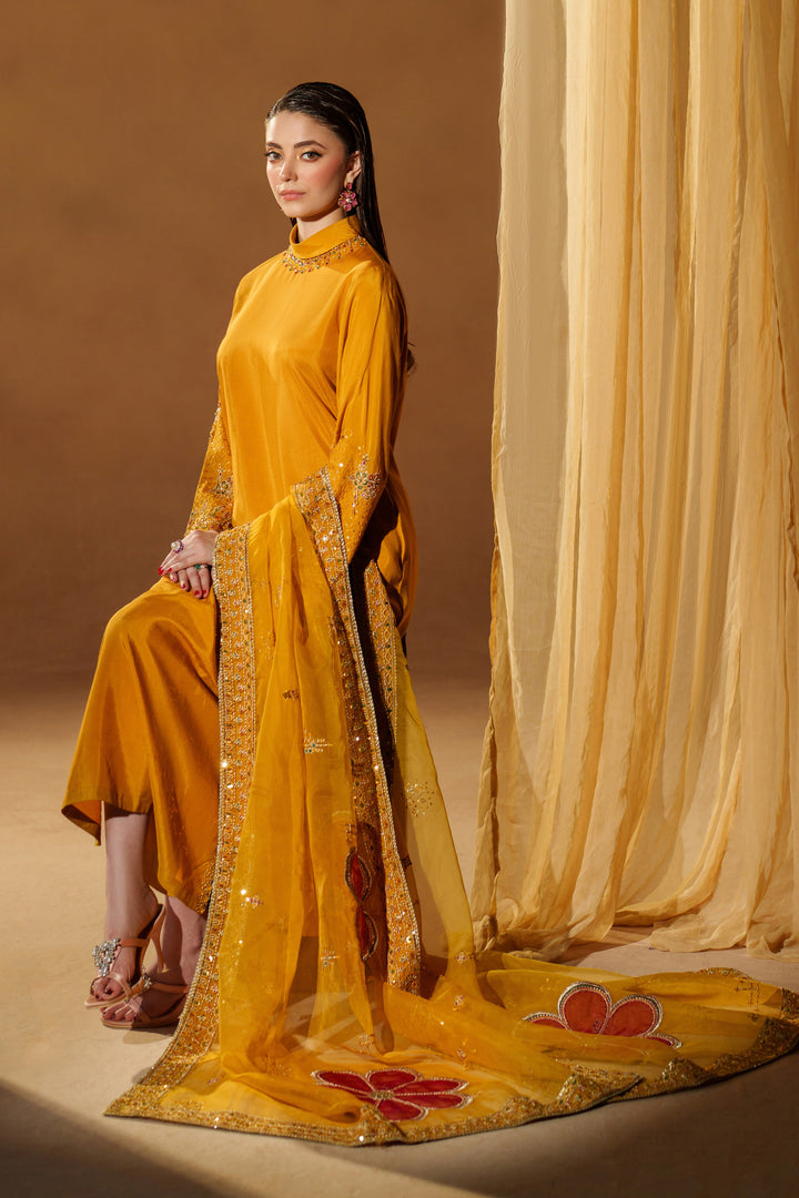 Full styled shot of NAQSHI Marlyin mustard yellow luxury pret outfit with embroidered dupatta set for festive events and evening celebrations